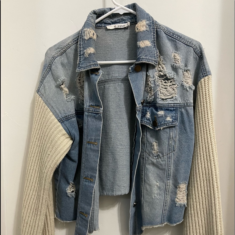 Unique distressed Jean jacket. Says small but Fits like a medium